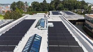 Solar panels on Irish house rooftop generating electricity in cloudy weather